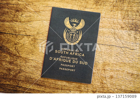 South African passport on table close up. Official identification document book for citizens of South Africa. Concept of travel and tourism 137159089
