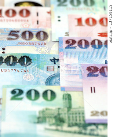 Taiwanese dollar paper banknotes pile on table. Taiwan TWD currency money bills in big amount. Concept of economics, taxation and banking in Taiwan 137159115