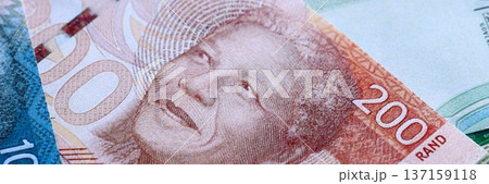 South African rand paper banknotes pile on table. South Africa ZAR currency money bills in big amount. Concept of economics, taxation and banking in South Africa 137159118