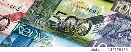 Kenyan shilling paper banknotes pile on table. Kenya KES currency money bills in big amount. Concept of economics, taxation and banking in Kenya 137159120