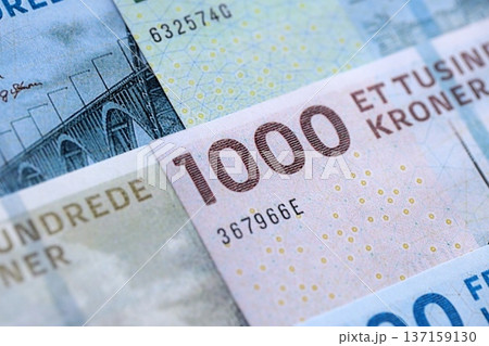 Danish krone paper banknotes pile on table. Denmark DKK currency money bills in big amount. Concept of economics, taxation and banking in Denmark 137159130