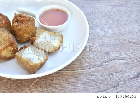deep fried mashed crab meat roll dumpling Chinese food on plate dipping sweet plum sauce 137160253