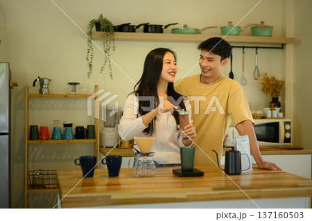 Couple making coffee in kitchen Couple making coffee in kitchen 137160503