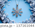Diamond studded snowflake charm elegantly displayed in a winter wonderland setting 137161044