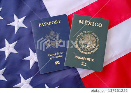 United States and Mexican passports on American flag background, dual citizenship and international travel concept United States and Mexican passports on American flag background, dual citizenship and international travel concept 137161225