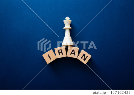 Chess king piece controlling iran wooden blocks 137162425
