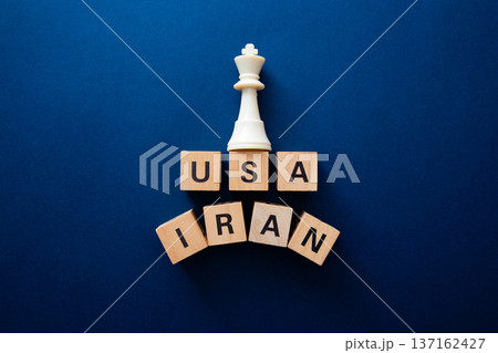 Chess king on usa and iran blocks representing conflict Chess king on usa and iran blocks representing conflict 137162427