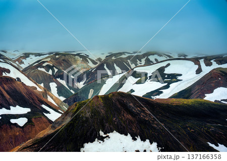 Scenery of volcanic mountain and snow covered in Blahnjukur trail on Icelandic highlands at Landmannalaugar 137166358
