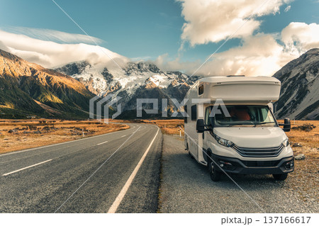 Motorhome parked on roadside with Mount Cook over road in autumn at New Zealand 137166617