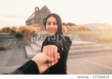 Romantic moment with asian woman holding hands with partner at Church of the Good Shepherd, New Zealand Romantic moment with asian woman holding hands with partner at Church of the Good Shepherd, New Zealand 137166629