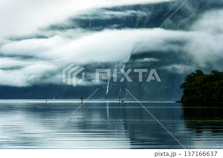 Milford Sound with waterfall in foggy on the lake at Fiordland national park, New Zealand 137166637