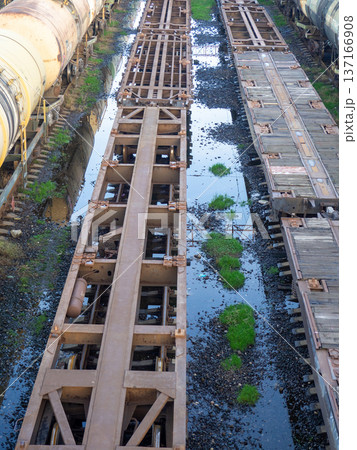 Empty freight train cars. Cars without a roof. Freight transportation. Freight train cars in the parking lot. 137166908