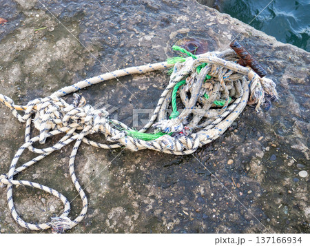 Place for attaching a small boat. Fittings for tying the mooring line. Mounting point. Small bollard on the pier. 137166934