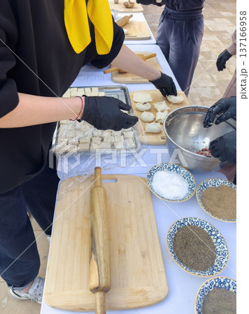 The family prepares the Uzbek national dish manti The family prepares the Uzbek national dish manti 137166958