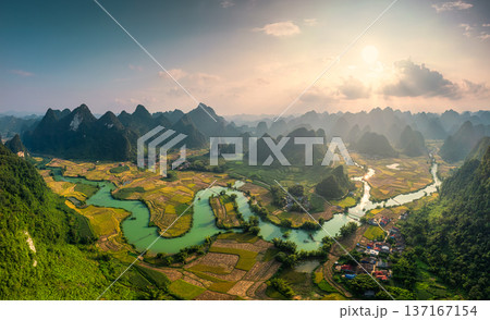 Phong Nam Valley with rice field and river flows through traditional village in countryside 137167154