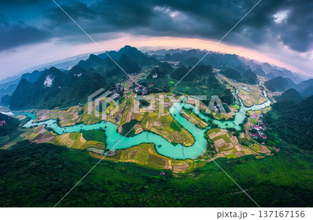 Phong Nam Valley with rice field and winding river through traditional village in countryside at Vietnam 137167156