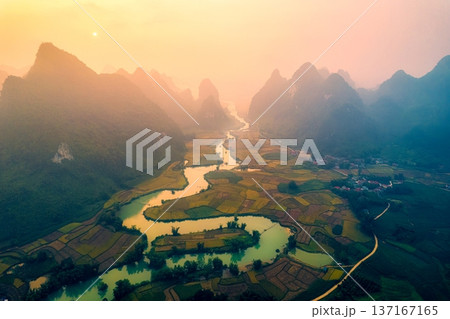 Golden sunrise over mountain range with winding river on agricultural village at Phong Nam Valley at Vietnam 137167165