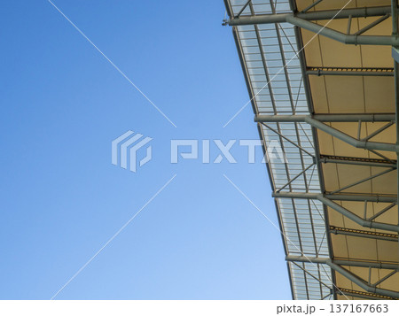 vault of a modern football stadium. Canopy of the sports arena. Metal construction. vault of a modern football stadium. Canopy of the sports arena. Metal construction. 137167663