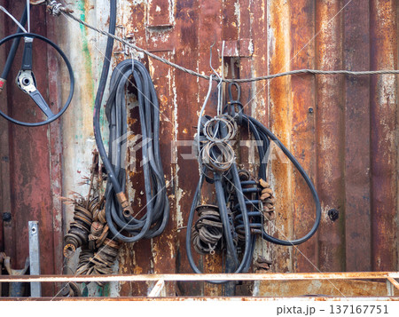 In an old auto repair shop. Rusty spare parts and machine elements. Abandoned car mechanic's office. Corrosion on spare parts. 137167751