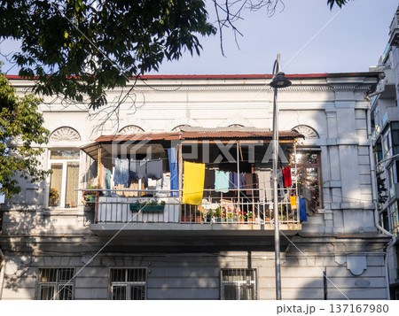 Linen on the old balcony. Life of local residents. Drying clothes. Linen on the old balcony. Life of local residents. Drying clothes. 137167980