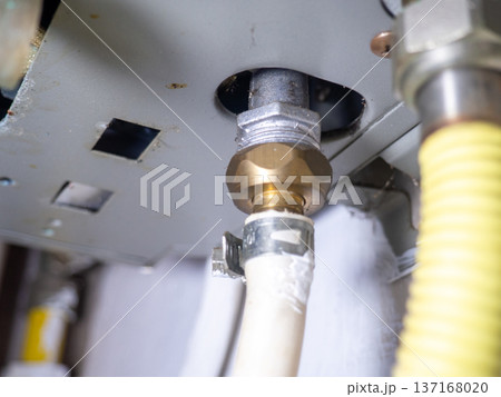 Part of gas equipment. Hoses in a gas water heater. Gas flows through these pipes at home. 137168020