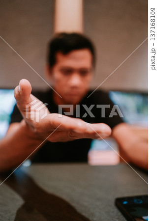 Man's Open Hand Reaching Out for Help and Connection 137168109