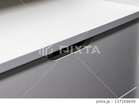 Modern shelving unit with a drawers in a wardrobe 137168698