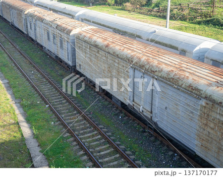 Freight trains. The concept of cargo transportation by rail. Cars for loading. 137170177