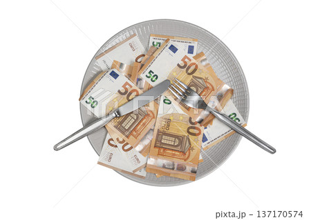 a plate with cutlery full of euro banknotes 137170574