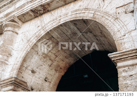 Ancient archway shows stone craftsmanship in historical building from a historic time period Ancient archway shows stone craftsmanship in historical building from a historic time period 137171193
