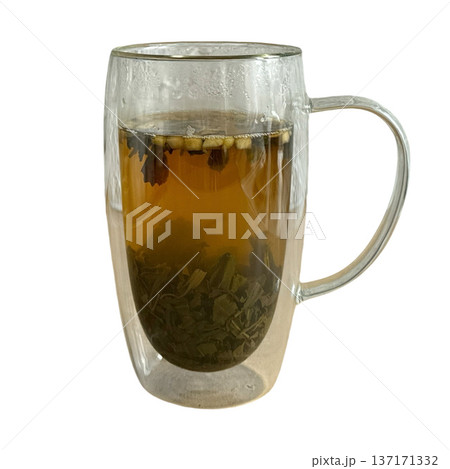 Green tea brewing in a double walled glass mug Green tea brewing in a double walled glass mug 137171332