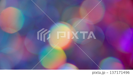 Blur circles. Neon light. Purple pink orange colorful lens flare rainbow round texture glisten on abstract vibrant bokeh background. 137171496