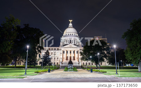 Mississippi State Capitol building stands in Jackson, USA. Historic Beaux-Arts architecture features the illuminated dome and stone columns under a dark night sky 137173650