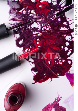 beautiful colorful abstract nail gel polish texture with applicators and orchid on white background 137174169