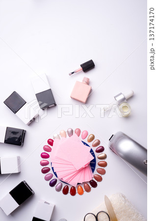 set for manicure with gell polish  bottles, LED lamp and accessoires on white background. flat lay 137174170