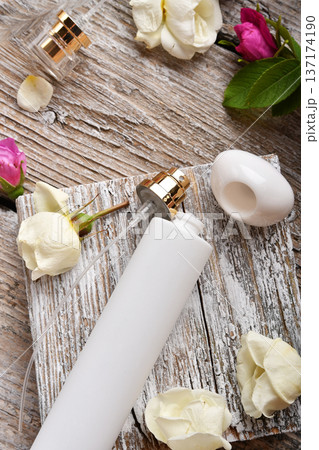 perfume empty bottles around roses settled at authentic provence background. Perfumer, beauty and trendy concept. macro. flat lay perfume empty bottles around roses settled at authentic provence background. Perfumer, beauty and trendy concept. macro. flat lay 137174190