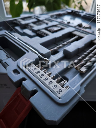 A set of PH and PC screwdriver bits in a gray plastic case. A set of PH and PC screwdriver bits in a gray plastic case. 137175627