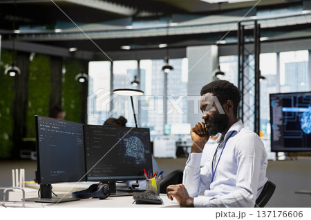 Programmer at work training machine learning models to monitor error logs for debugging processes. Tech startup employee using artificial intelligence to identify and resolve technical issues 137176606