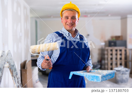 Portrait of smiling man painter in apartment 137180703