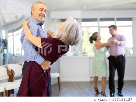 Senior man and elderly woman are dancing classic version of waltz in couple 137181124