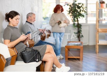 People of different ages sitting in clinic queue 137181219