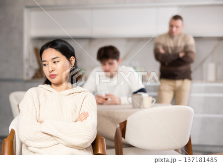 Adult and young man quarreling with woman Adult and young man quarreling with woman 137181485