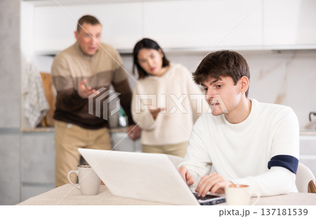 Disgruntled relatives of young man scold him for his passion for computer games Disgruntled relatives of young man scold him for his passion for computer games 137181539