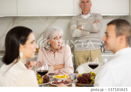 Elderly parents do not approve of tender relationship between adult son and his girlfriend 137181625