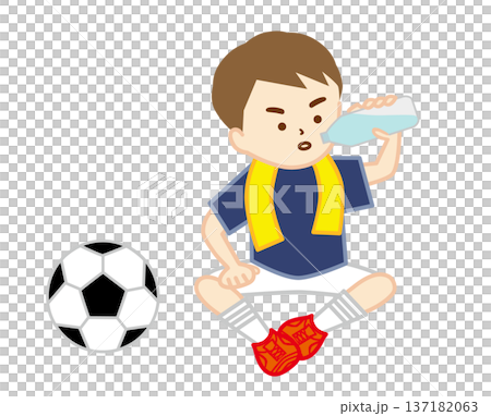 A soccer boy sitting on the ground with a towel around his neck to hydrate 137182063