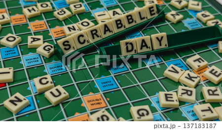 National Scrabble Day celebration with board game and letter tiles National Scrabble Day celebration with board game and letter tiles 137183187