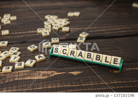 Scrabble tiles on a wooden table for National Scrabble Day 137183196