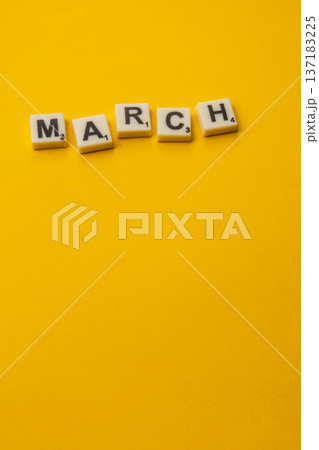 Celebrating National Scrabble Day with letter tiles spelling March 137183225