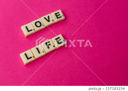 Celebrate National Scrabble Day with letters forming love and life 137183234