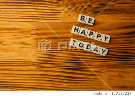 Celebrate National Scrabble Day with words on wooden table Celebrate National Scrabble Day with words on wooden table 137183237